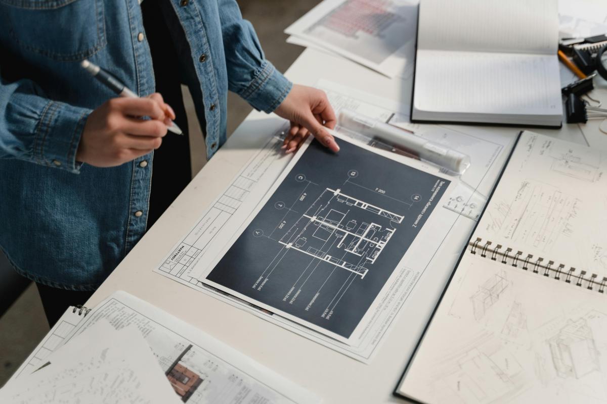 Close-up of architectural blueprints being drawn.