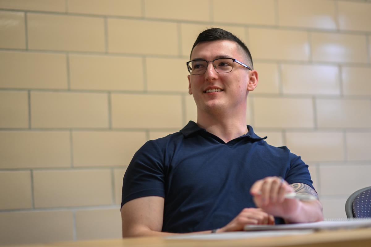 Counseling student smiling in the classroom.