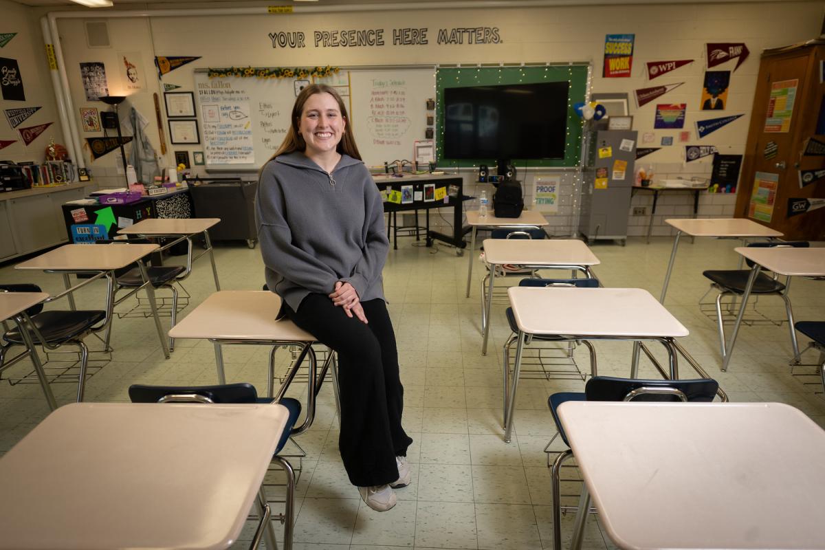 Education student smiling in a classroom during student teaching.