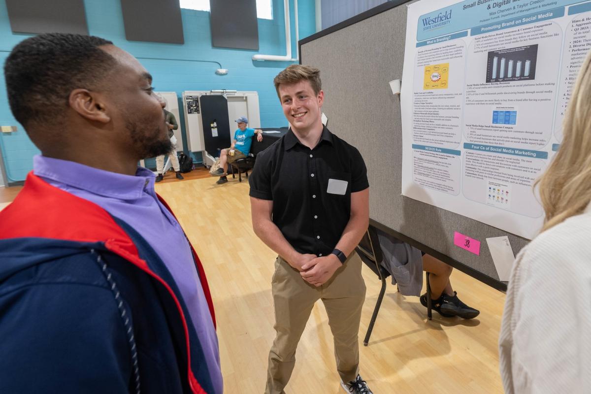 Marketing student sharing research findings with another student.