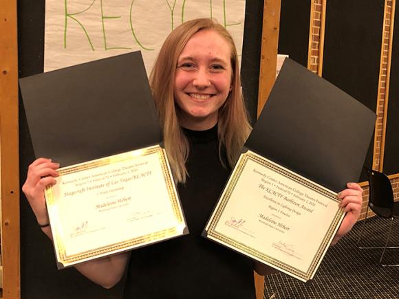 Westfield State University senior Madeleine Hebert holding two of her awards