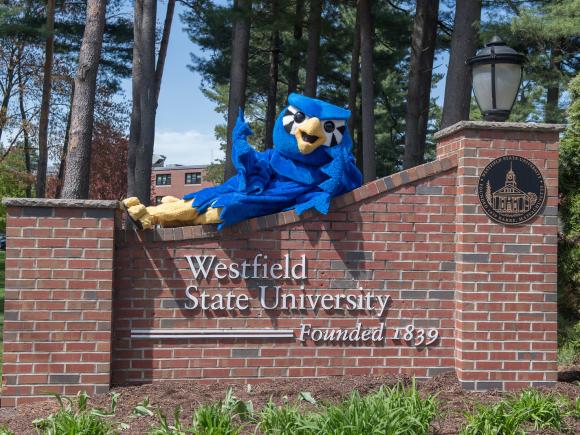 Nestor Mascot posing on University Gate