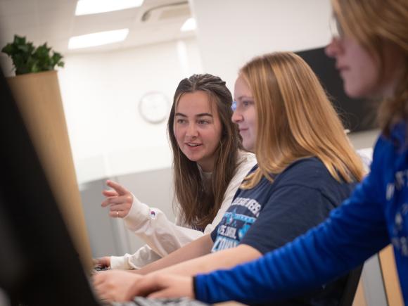 Students work on the computer in the career center to update their profiles for potential job matches