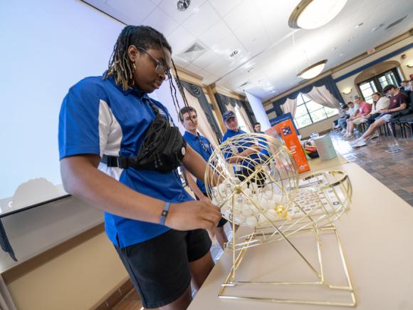 New Student Orientation. A student draws for Student Involve Bingo at the end of the day.