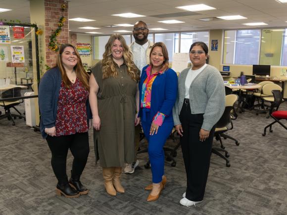 Group of five CARE Center staff smiling.