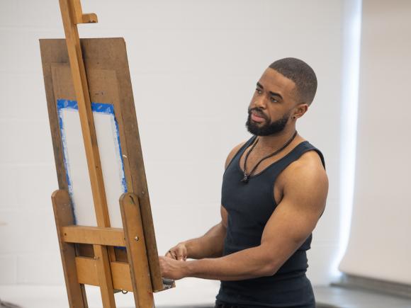 Art student working on a painting.