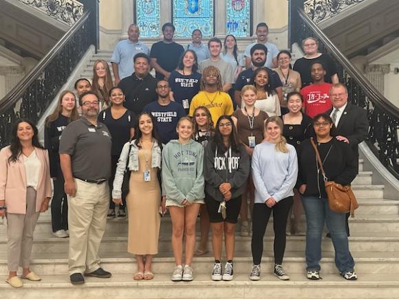 A photo of Charles DiStefano's state and local government class on the capital steps in Boston. The students pose as they explored the capital building and learned how legislation works in the culmination of their summer class.