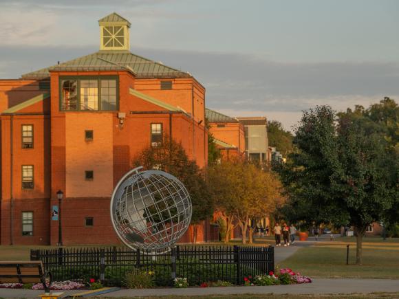 Campus globe in front of Courtney Hall.