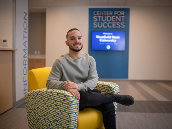 Reading Specialist student smiling outside the Center for Student Success office.