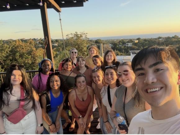 Group of nursing students smiling during a travel study experience.