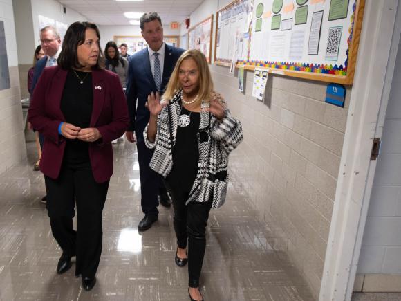 People tour a building
