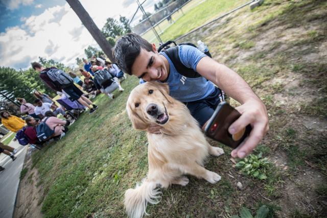 student with dog