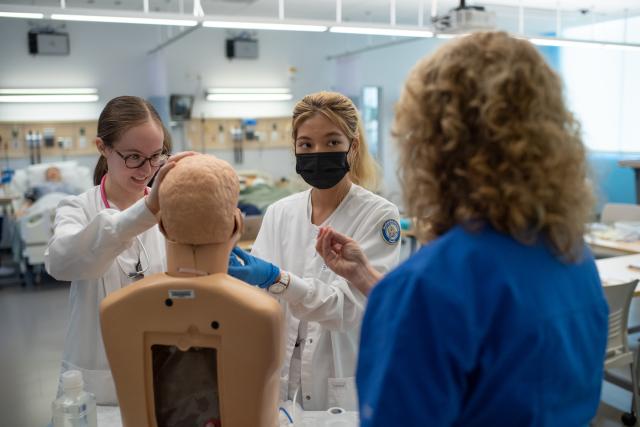 Nursing Sim Lab Students with Professor