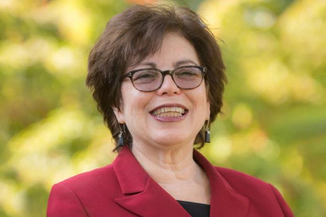 Poli-Sci Professor Marsha Marotta smiles while posing for a photo.