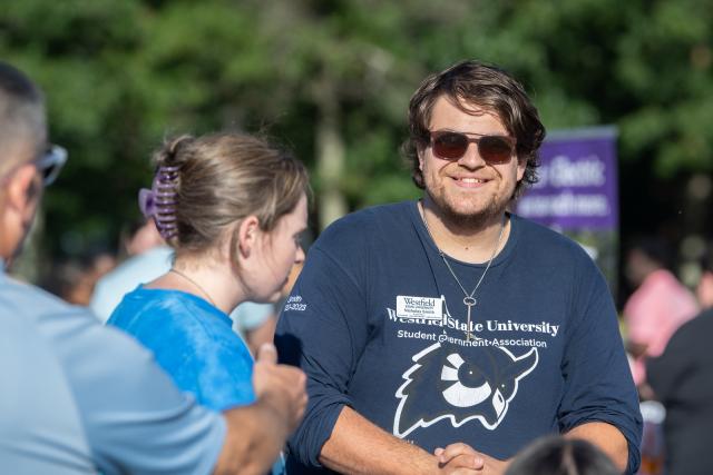 Student Government Association member Nicholas Smith smiling at an event