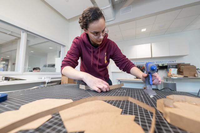 Student from a design class working on a project in the RIDE Center.