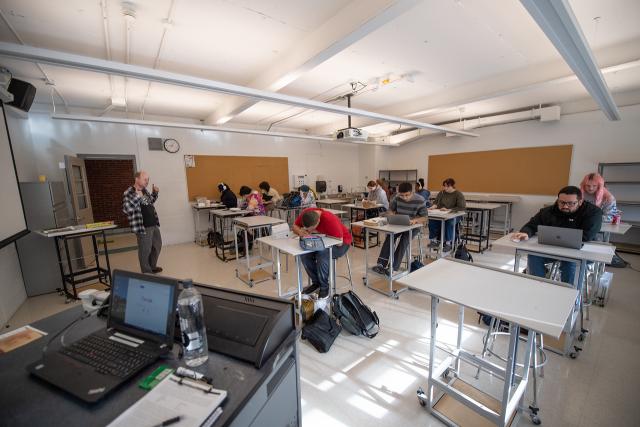 Dower 273 Design Studio with students at desks and instructor speaking.