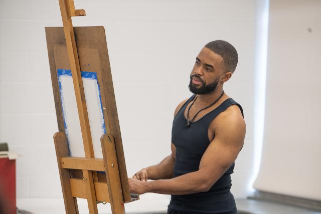 Art student working on a painting.