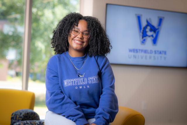 Social work student smiling wearing a WSU sweatshirt.