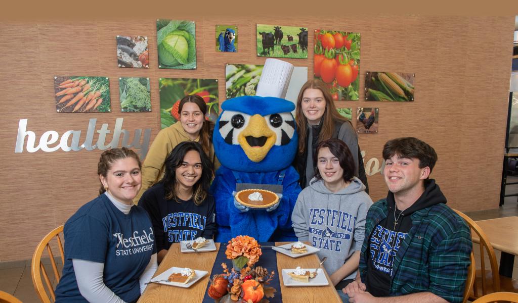 Nestor serves up some pumpkin pie to students for Thanksgiving in the Dining Commons