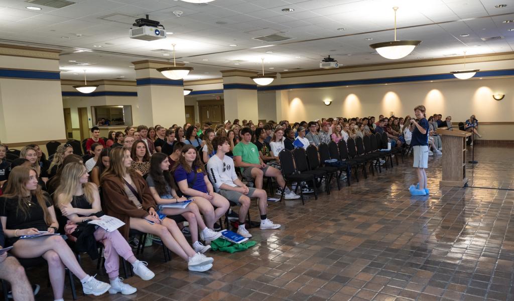 New Student Orientation with students listening to a presentation.