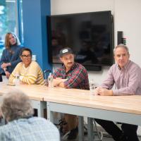 From left, Sheila Coon, of Hot Oven Cookies, Ted Dobek, of Circuit Coffee and Bob Lowry of Bueno Y Sano, speak to students, faculty and staff at the Entrepreneurs of Western Mass panel discussion at the RIDE center on November 6. 