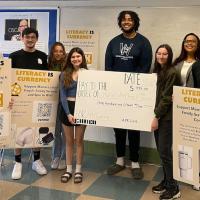 "Students from Westfield State University's "Advanced Public Relations" course pose with Shannon Rudder, executive director and CEO of Martin Luther King Jr. Family Services, and the $915 they raised for the nonprofit. Left to right, Joe Dateo, Matthew Bunszell, Giana Isola, Grace Murray, Alvin Yvon, Alexis Crafts, Rudder, and Brandon Hager." From MassLive's website.