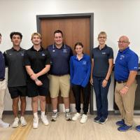 Five Westfield State students stand with three faculty and staff members from the Athletic Training program.